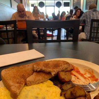 Bakery Mill & Deli - Midway through a bacon and provolone omelette, wheat toast and home fried potatoes. - Bakeries Near Me - Gainesville, Florida Bakery Mill & Deli - Midway through a bacon and provolone omelette, wheat toast and home fried potatoes. - Bakeries Near Me - Gainesville, Florida