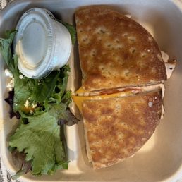 Kids turkey sandwich with side salad.