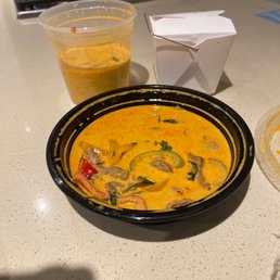 Rice, half a curry and another curry dish with a ton of sauces. Rice, half a curry and another curry dish with a ton of sauces.