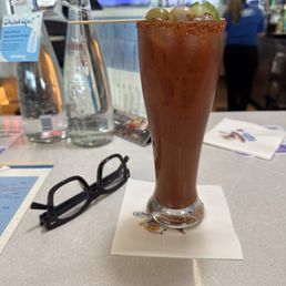 Vodka Bloody Mary - two delish olives and pretty tasty bloody mix.  Unsure what vodka but slightly sweet.