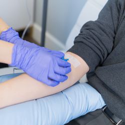 Infusion nurse administering IV Drip