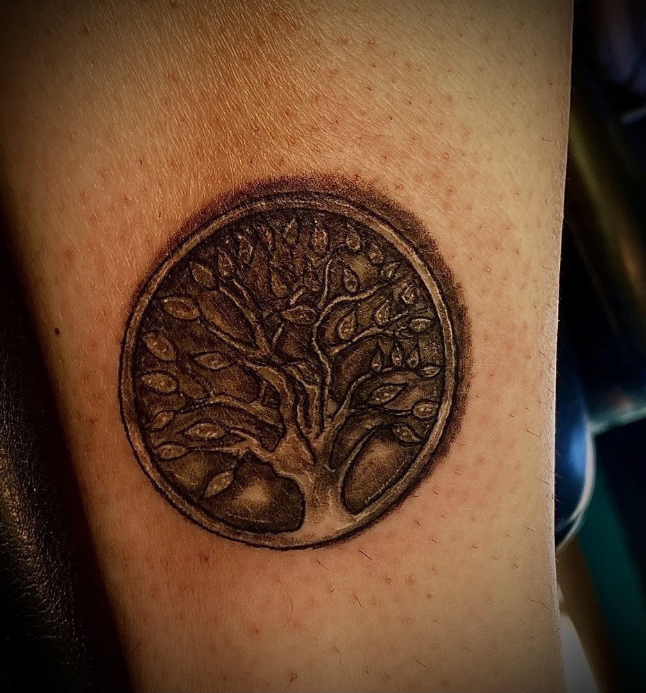 Sacred Tattoo Logo