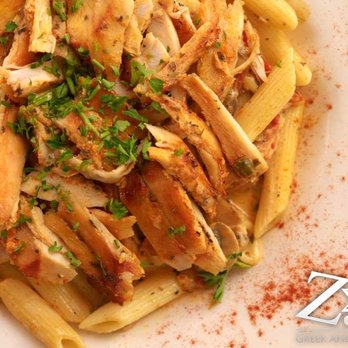 Zeus Cafe - a plate of pasta with chicken and sauce - Mediterranean Near Me - Lafayette, Louisiana Zeus Cafe - a plate of pasta with chicken and sauce - Mediterranean Near Me - Lafayette, Louisiana