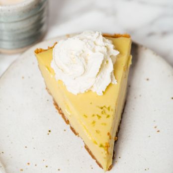 Cafe Loft - a slice of cheesecake with whipped cream - Coffee & Tea Near Me - Los Angeles, California