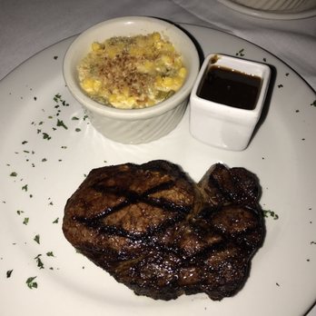 ALC Steaks - 12 oz ribeye with the green chile creamed corn and ALC house sauce - Steakhouses Near Me - Austin, Texas ALC Steaks - 12 oz ribeye with the green chile creamed corn and ALC house sauce - Steakhouses Near Me - Austin, Texas