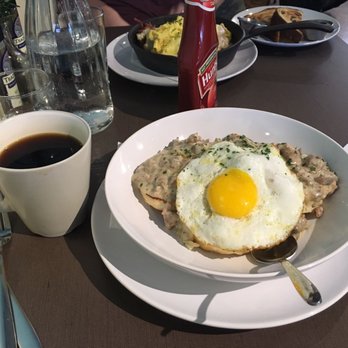 Lucy's - Sausage biscuits and gravy with sunny side up egg. Delish! - Coffee & Tea Near Me - Grand Rapids, Michigan