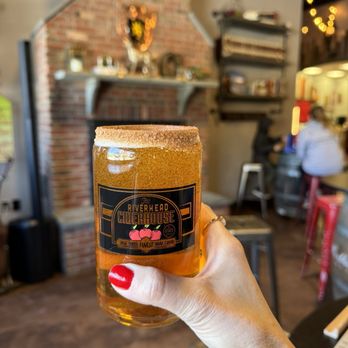 Riverhead Cider House - a hand holding a glass of cider - Beer, Wine & Spirits Near Me - Calverton, New York Riverhead Cider House - a hand holding a glass of cider - Beer, Wine & Spirits Near Me - Calverton, New York
