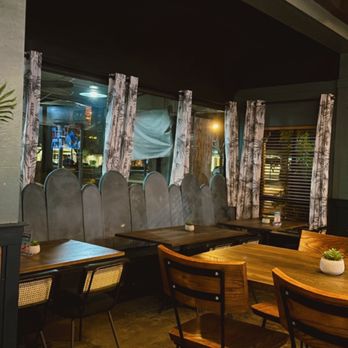 Shores Bar + Kitchen - tables and chairs in a restaurant - American Near Me - San Marcos, California Shores Bar + Kitchen - tables and chairs in a restaurant - American Near Me - San Marcos, California