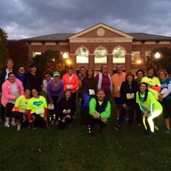 Fleet Feet Asheville - Night Life- training programs in front of the YMCA.