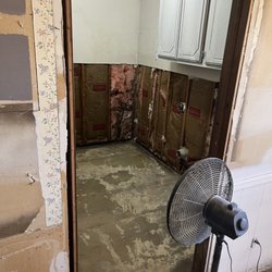 Duvall Plumbing - West wall drywall removed ready for repair
