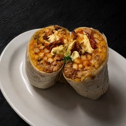 A 13" flour tortilla packed with savory asada, crispy bacon, fluffy eggs, hearty beans, golden fries, melted cheese, fresh onion, cilantro.
