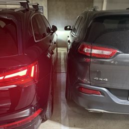 Two typical spaces in the complex, leaves no room for either car to enter. Two typical spaces in the complex, leaves no room for either car to enter.