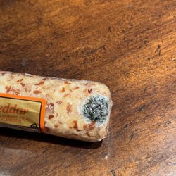 Harrington Hams - A cheese log from Harrington's of Vermont arrived moldy -- their customer service rep told me to eat around it!