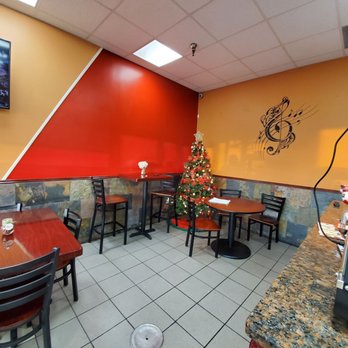 Nelly Latin Restaurant - a christmas tree in the corner - Dominican Near Me - Chester, New York Nelly Latin Restaurant - a christmas tree in the corner - Dominican Near Me - Chester, New York