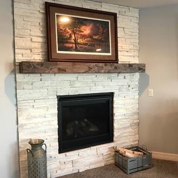 Trent's Custom Basements - a fireplace in a living room - General Contractors Near Me - La Vista, Nebraska Trent's Custom Basements - a fireplace in a living room - General Contractors Near Me - La Vista, Nebraska