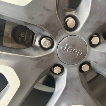 Tomball Dodge Chrysler Jeep - Lug nut on my passenger front tire. You can see the one they messed with is all dented. - Car Dealers Near Me - Tomball, Texas Tomball Dodge Chrysler Jeep - Lug nut on my passenger front tire. You can see the one they messed with is all dented. - Car Dealers Near Me - Tomball, Texas