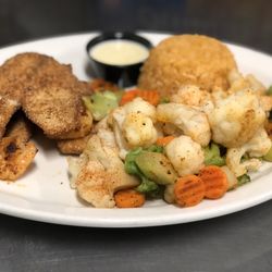Avocado’s - Stuffed Fish- Breaded Fish Stuffed with Shrimp and Covered in Cheese. Served with Steamed Veggies and Mexican Rice.