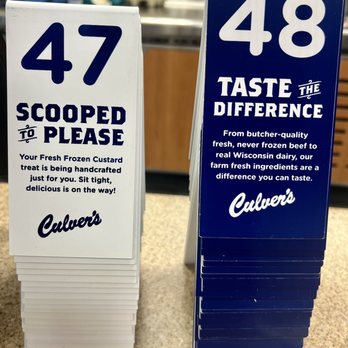 Culver's - Table numbers - Stacks of signs numbered 47 and 48 display promotional messages at Culver's, emphasizing fresh frozen custard and quality ingredients. - Ice Cream & Frozen Yogurt Near Me - Evergreen Park, Illinois