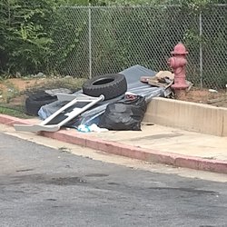 Ardent Residential - Why does a single family residence have a trash compactor, which is being used as a dump site, instead of individual trash cans.