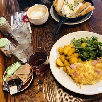 The Common - 3 Poached Eggs Skillet in Tomato, Onion, and Pepper Stew Skillet and French Omelet - Breakfast & Brunch Near Me - Brooklyn, New York