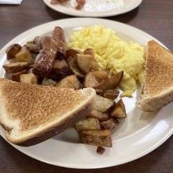 Curleys Cafe - Breakfast platter with scrambled eggs, home fries, sausage links and toast.