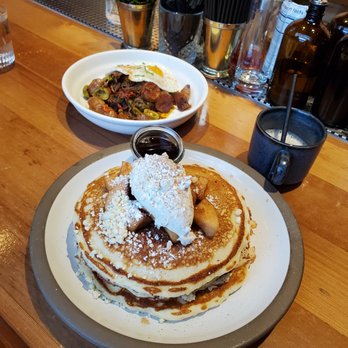 Cindy's Rooftop - Ropa Vieja far left Half stack of pancakes with apples and cream - New American Near Me - Chicago, Illinois