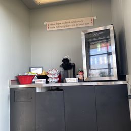 Waiting area with free drinks and snacks!