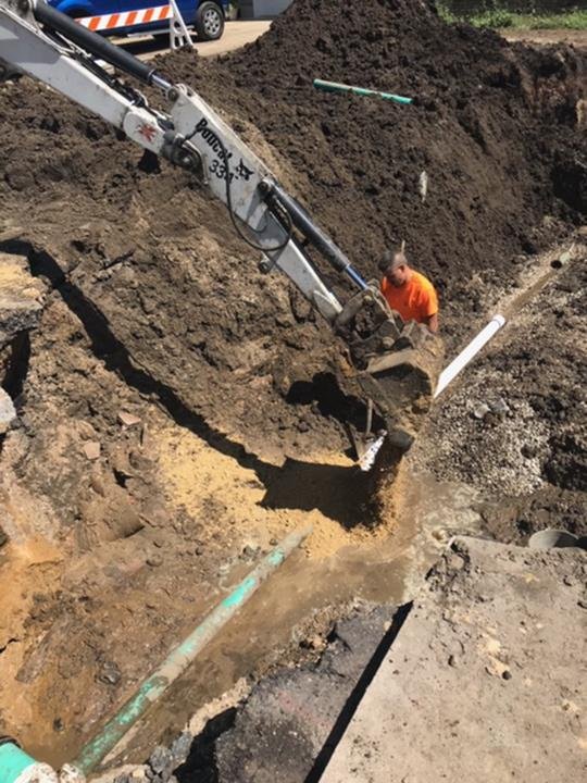 Slide of Suburban Sewer & Septic