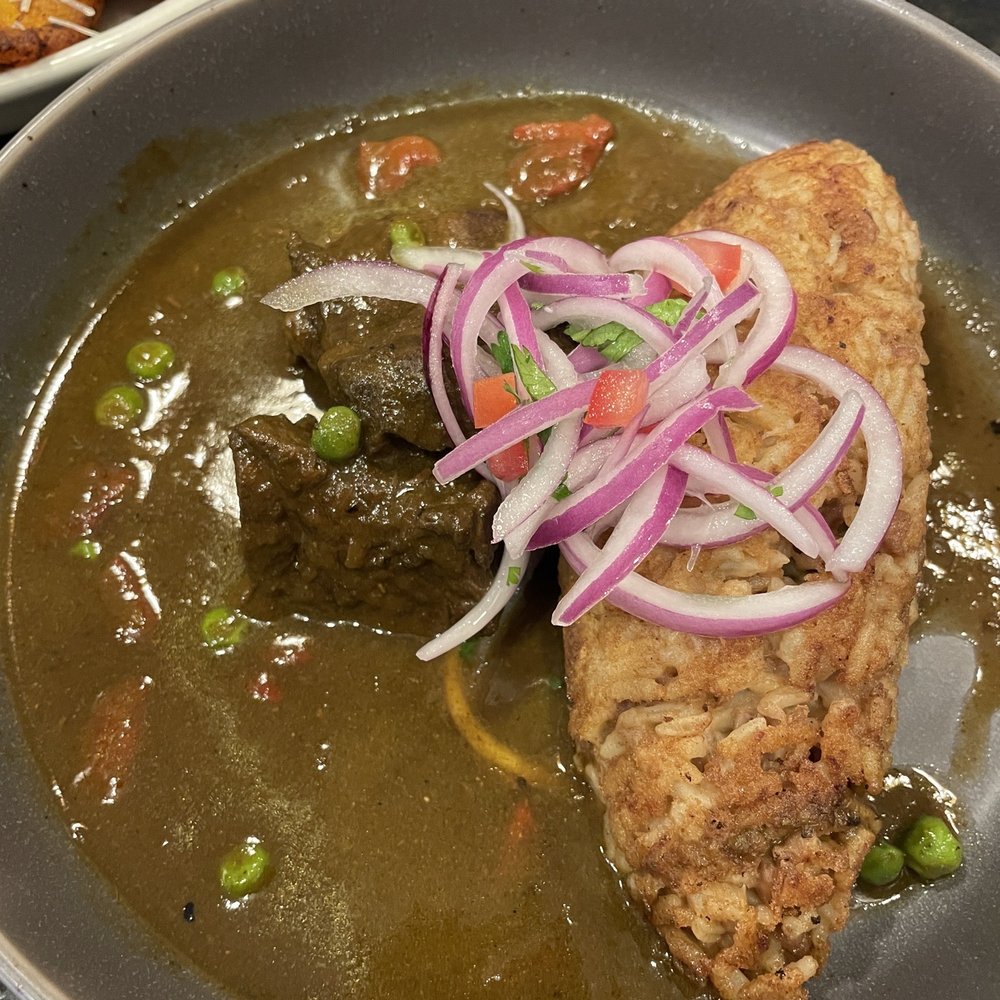 Inka Grill - Beef stew with rice and beans, pickled onions - Peruvian Near Me - Roanoke, Virginia Inka Grill - Beef stew with rice and beans, pickled onions - Peruvian Near Me - Roanoke, Virginia