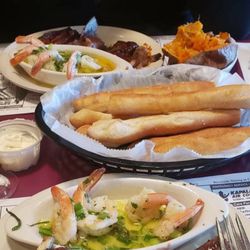 Gregs Restaurant - Ribs and shrimp scampi. Baked potato other sweet potato and u have to order the bread sticks full orders with there cream cheese dip omg.