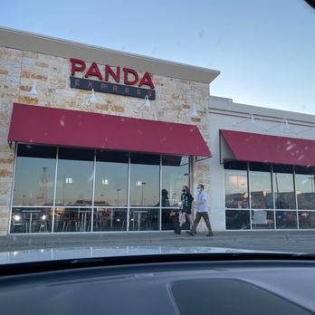 Panda Express - a man and woman walking in front of a restaurant - Chinese Near Me - Waco, Texas
