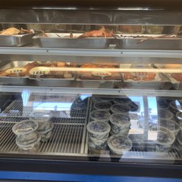 a display case filled with donuts