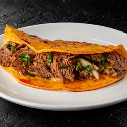 Fuego Cravings - 6" corn tortilla filled with tender birria, fresh onion, and cilantro.
