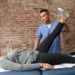 LES Acupuncture & Bodywork - Going through an orthopedic test