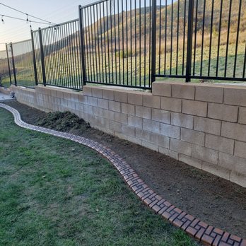 Kwik Kerb by Guido - a fence and a brick path - Landscape Architects or Designers Near Me Kwik Kerb by Guido - a fence and a brick path - Landscape Architects or Designers Near Me