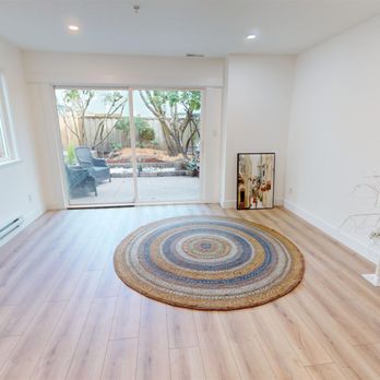 Paul Eviston - RE/MAX Select Properties - The living room of our newest real estate for sale.  It's views over the garden and is great for a new family. - Real Estate Agents Near Me - Vancouver, British Columbia