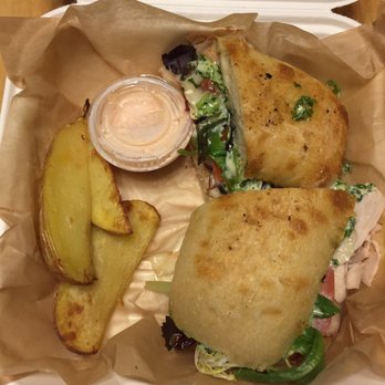 Tecumseh Brewing Company - My carry out order....Turkey pesto and 3 potato wedges after they charged me $3 extra for potato wedges. This place is cheap! - Breweries Near Me - Tecumseh, Michigan