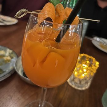 Ambar Shaw - The carrot ginger fizz drink that I closed on. It's amazing (like so much of this menu). - Modern European Near Me - Washington, DC, District of Columbia Ambar Shaw - The carrot ginger fizz drink that I closed on. It's amazing (like so much of this menu). - Modern European Near Me - Washington, DC, District of Columbia