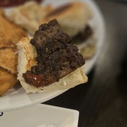 Larks Entertainment - Tiny piece of overcooked meat on slider