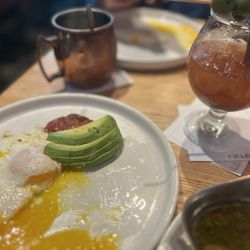 Fielding's Wood Grill - Eggs over easy, avocado, sun dried tomato, Bloody Mary, chimichurri steak, and a Moscal Mule.