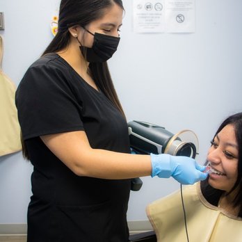 Dulce Dental - Dental hygienist takes x-ray of root canal patient at Dallas dentist Dulce Dental - General Dentistry Near Me - Dallas, Texas Dulce Dental - Dental hygienist takes x-ray of root canal patient at Dallas dentist Dulce Dental - General Dentistry Near Me - Dallas, Texas