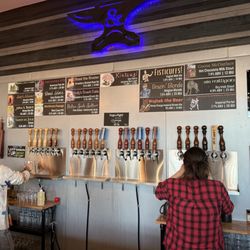 Quenched & Tempered Brewery - Draft beer taps and labels.
