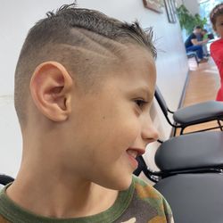 Park Barber Shop - My son's cut -- high and tight with a lightning bolt on the side. He loves it!