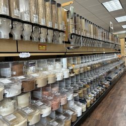 Sunrise Natural Foods - Bulk food bins are next to the produce