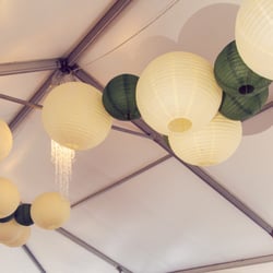 T R U Event Rental - Lanterns hanging from our TRU tent for outdoor wedding reception at Mesker Park Zoo.