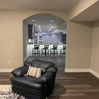 Nova Contractors - a living room with a leather couch - General Contractors Near Me - Lorton, Virginia