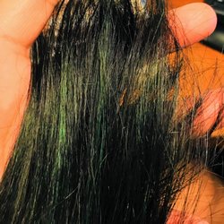Vanity Hair Studio at Sola Salons - Requested & PAID for an ALL OVER PERMANENT Blue/Black color. Instead I received teal/Green streaks :(