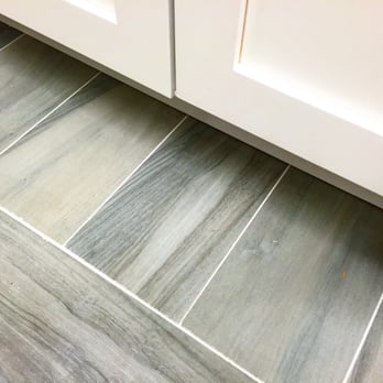 Forest Kitchen & Bath - Porcelain wood grain tiles against white cabinets are in this summer! Redo your floors with something different the next tim... - General Contractors Near Me - Glen Cove, New York Forest Kitchen & Bath - Porcelain wood grain tiles against white cabinets are in this summer! Redo your floors with something different the next tim... - General Contractors Near Me - Glen Cove, New York