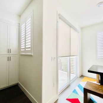 iHomeShutters - Sunland Polycore Shutter in kitchen & Norman Roller Shade in dining room - Shutters Near Me - San Ramon, California