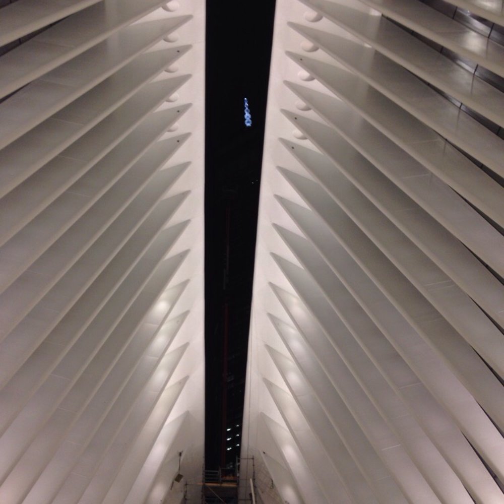 Oculus - the blue light seen through the window is one world trade center (Inside the Oculus-WTC Transportation Hub) - Landmarks & Historical Buildings Near Me - New York, New York
